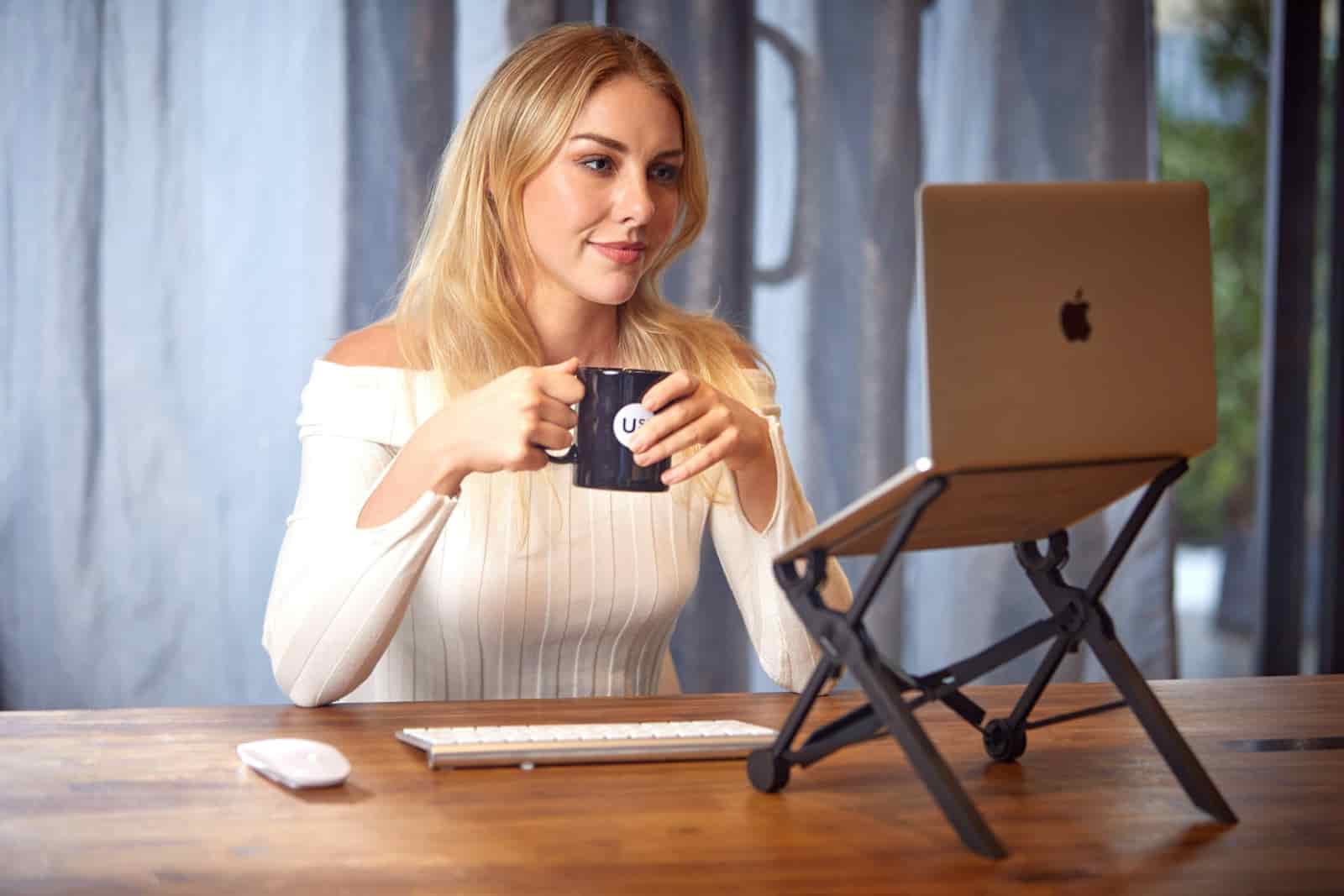 Travel advisor using AI and business technology at a laptop