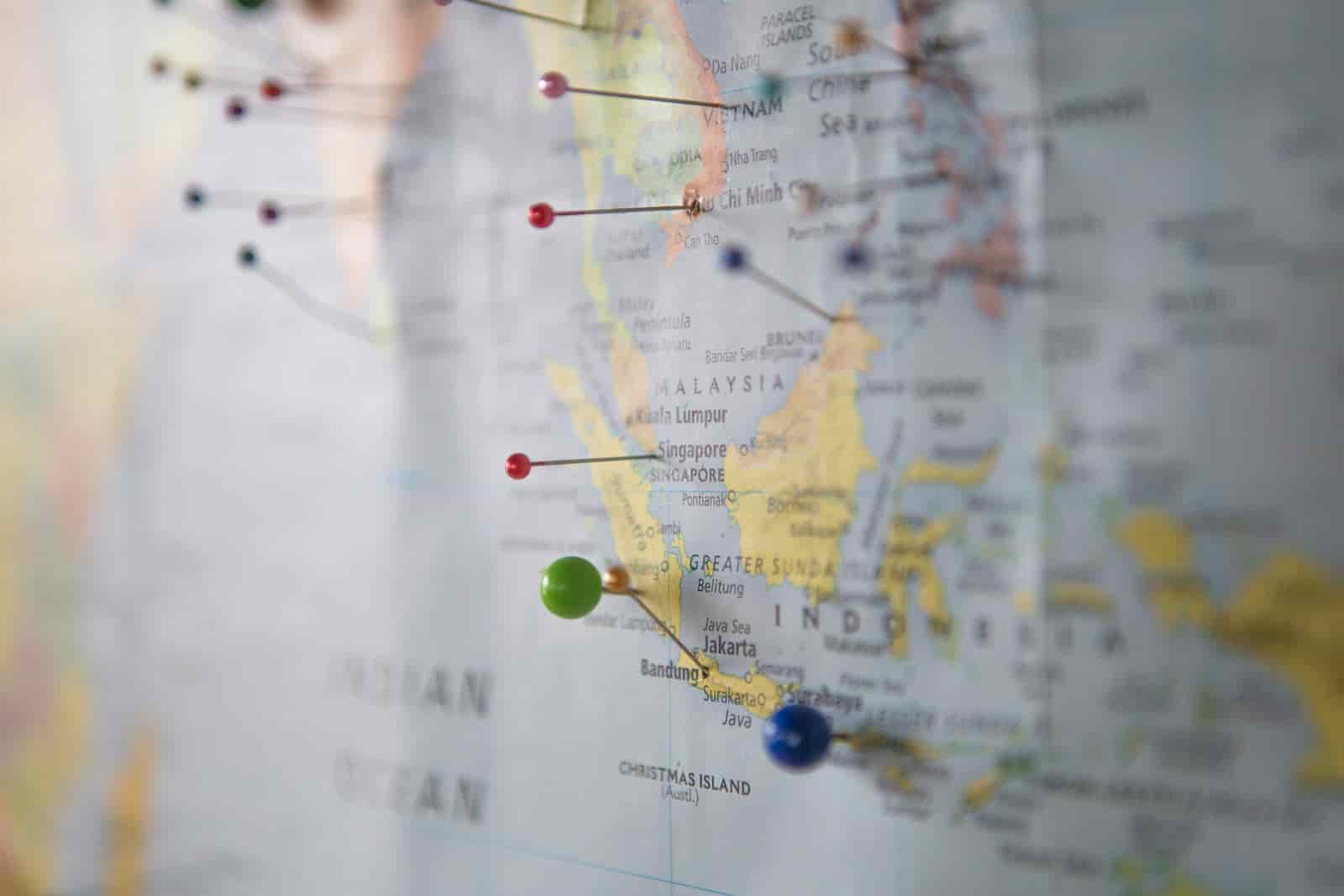 World map with location pins representing travel agency business growth