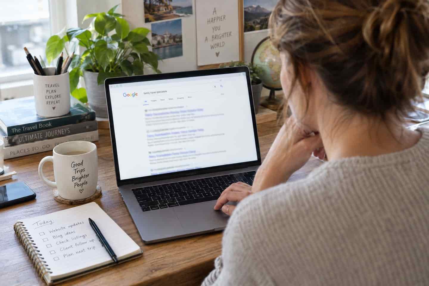 Travel agency owner checking where her website ranks on Google.
