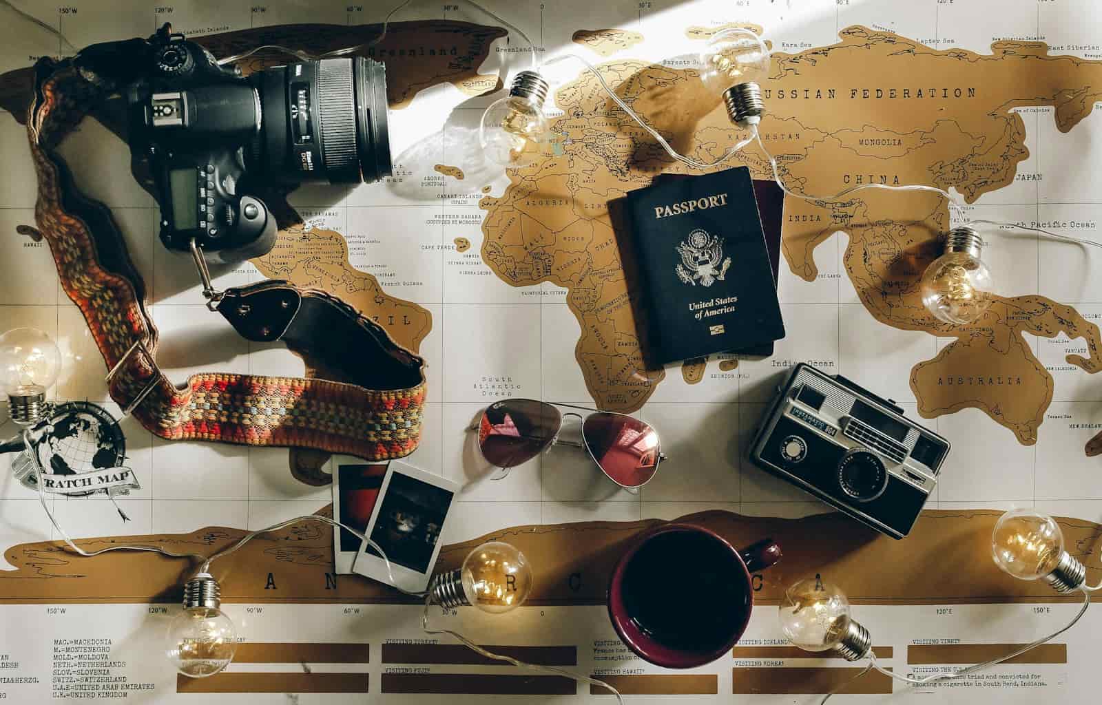 Camera and passport ready for travel advisor social media content creation