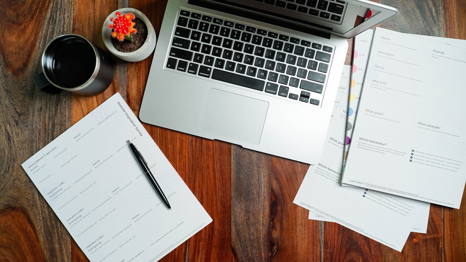 A tidy desk workspace prepared with the intake form and notes ahead of a discovery call.