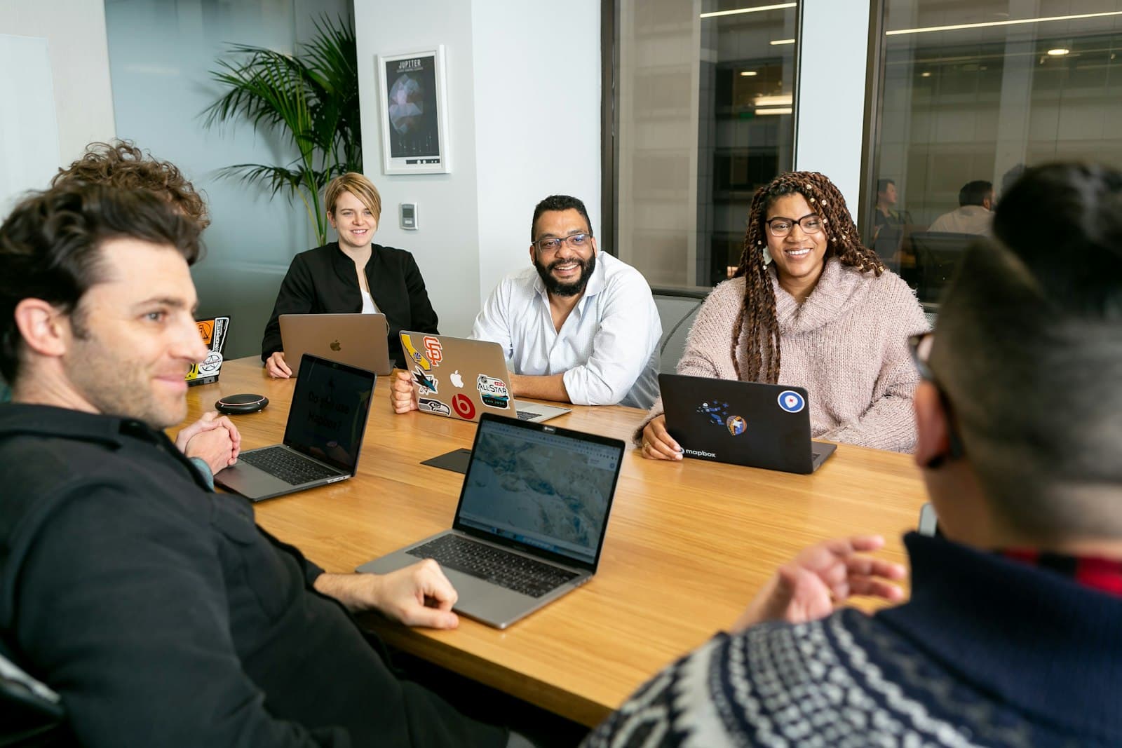 A team working together on laptops, the kind of side-by-side comparison that cuts through CRM options faster than a chart A team working together on laptops, the kind of side-by-side comparison that cuts through CRM options faster than a chart