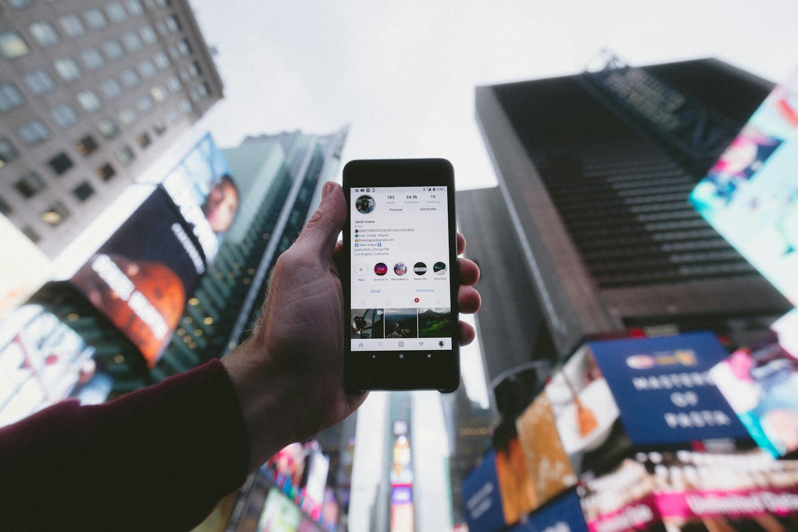An advisor checking social channels on their phone between meetings, the two channels that anchor a lead generation system. An advisor checking social channels on their phone between meetings, the two channels that anchor a lead generation system.